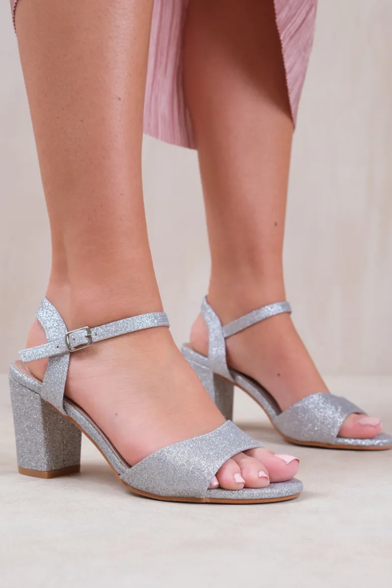 PAITYN BUCKLE UP LOW BLOCK HEEL SANDAL IN MOON SILVER GLITTER